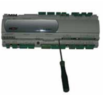 Removing the serial card slot cover on the KLM controller